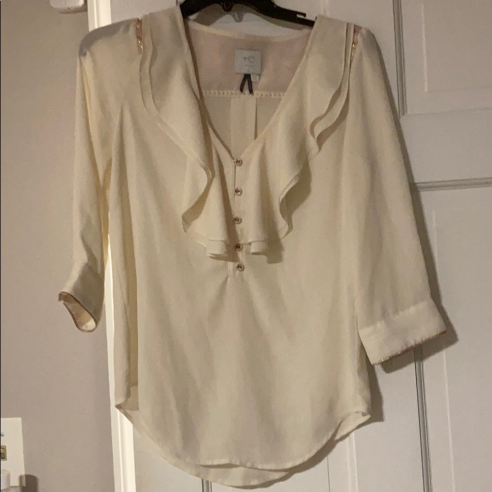 Flowy cream colored blouse from Anthropologie